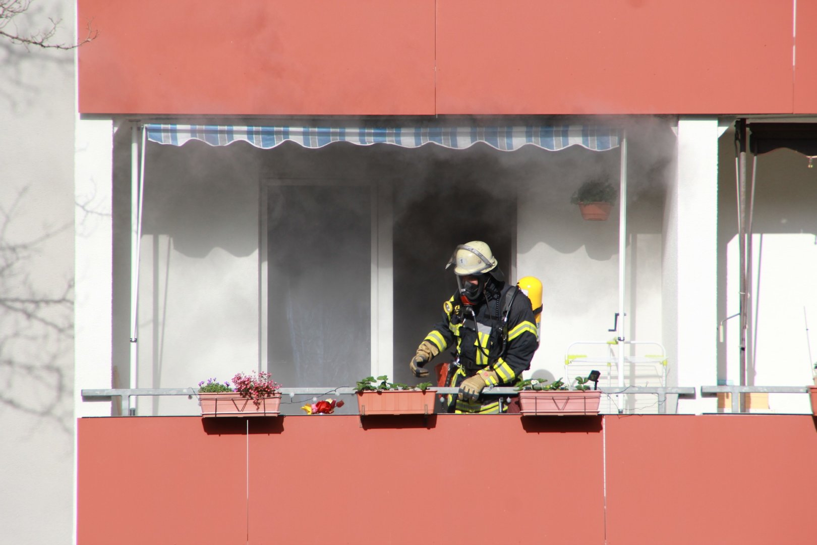 Firefighter putting out an apartment fire