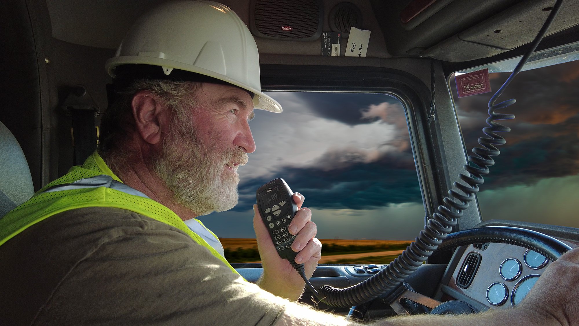 Heavy vehicle driver using a dispatch radio while driving