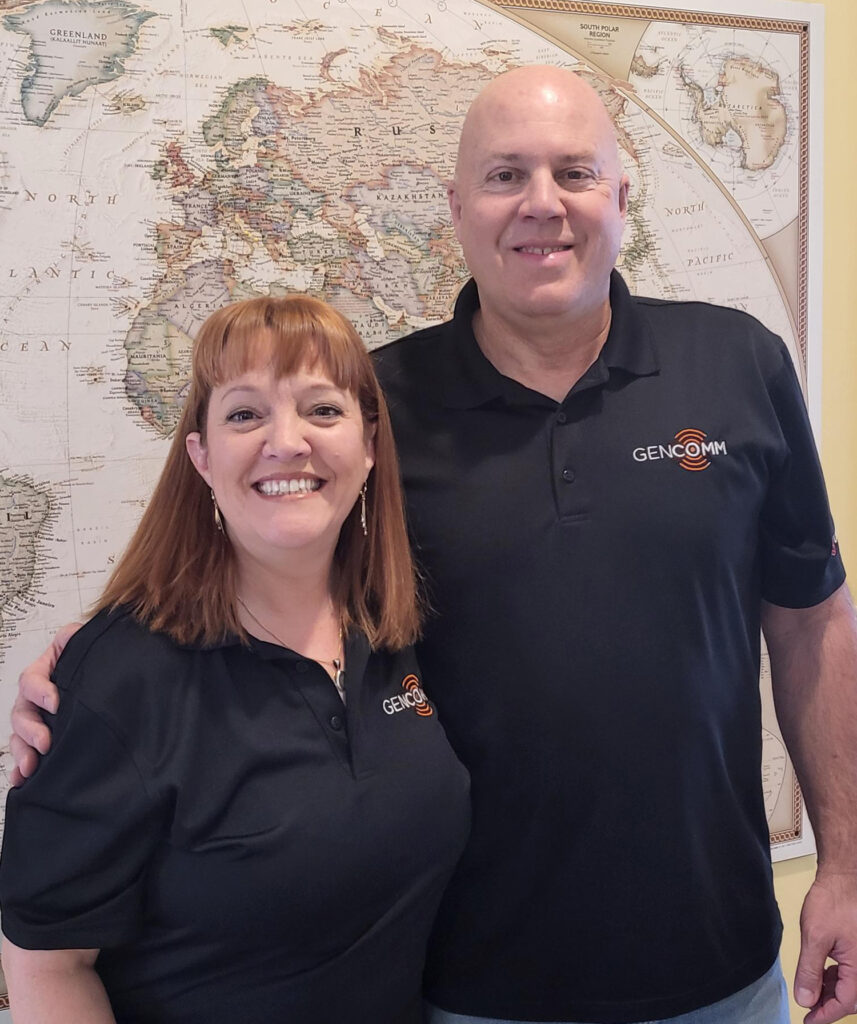 Greg and Jenni Vlack standing in front of map