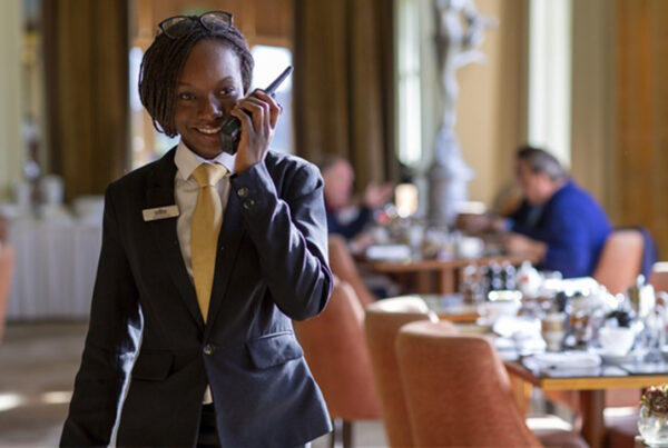 woman at hotel using an efficient two-way radio