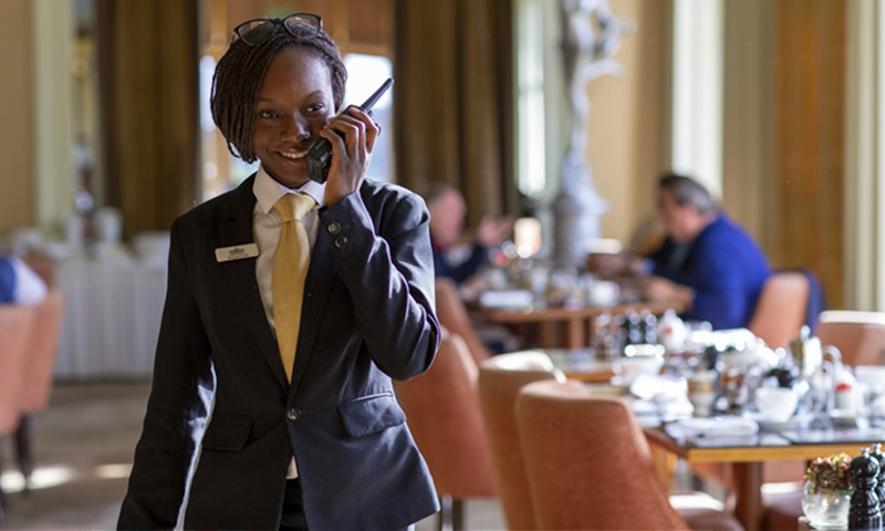woman at hotel using an efficient two-way radio