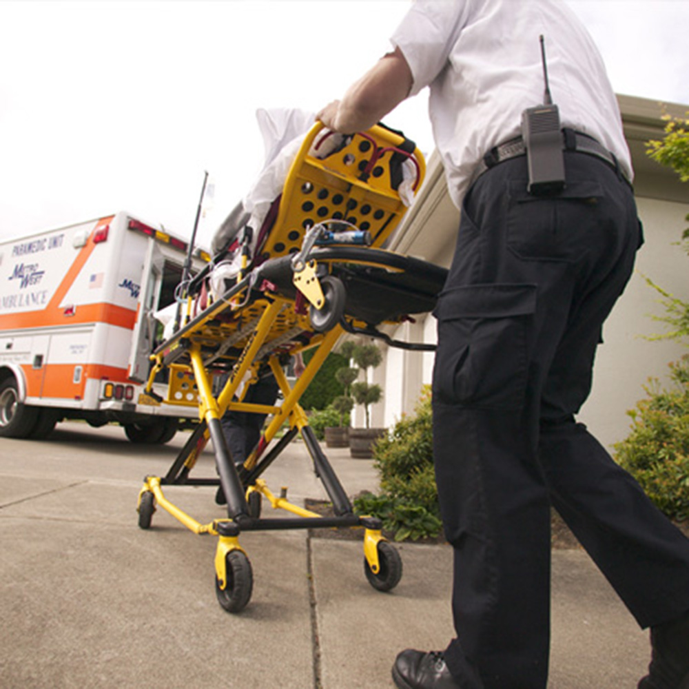 EMS - medical personnel with gurney, ambulance and Kenwood two-way radio