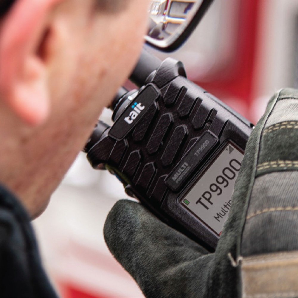 Worker using a Tait TP9900 radio